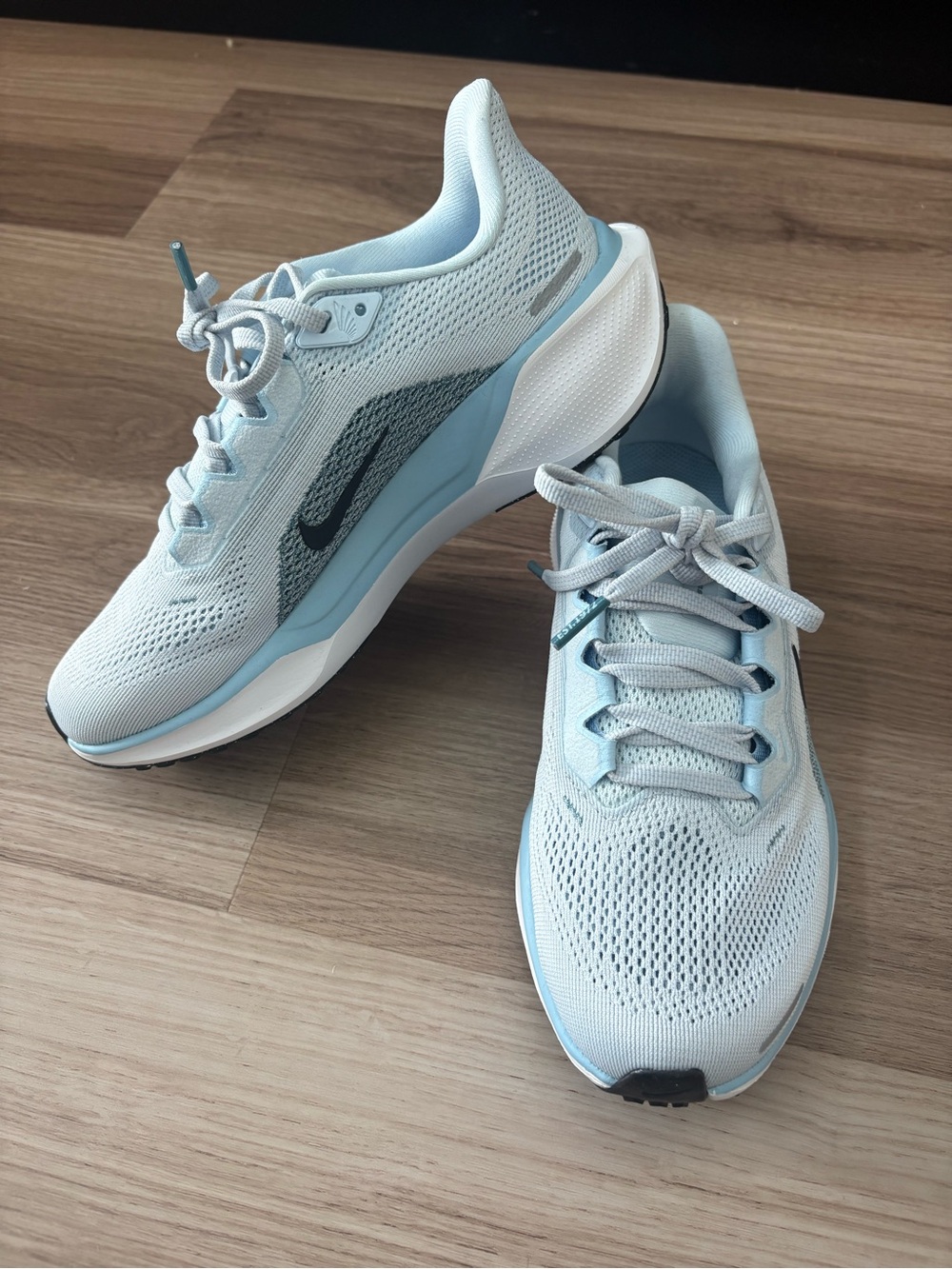 Nike Women's Pale Blue Mesh Running Shoes with Grey Swoosh